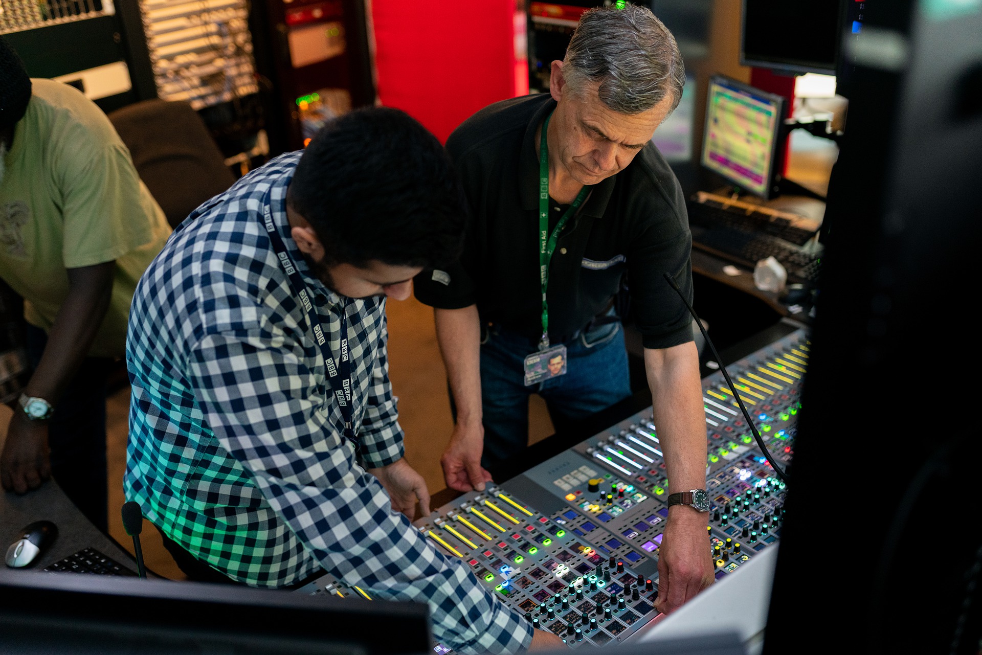 Audio engineers preparing for broadcast