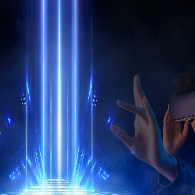 Woman wearing a virtual reality headset interacting with a bright shaft of light.