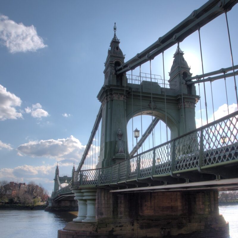 Hammersmith Bridge against a blue sky with the odd cloud